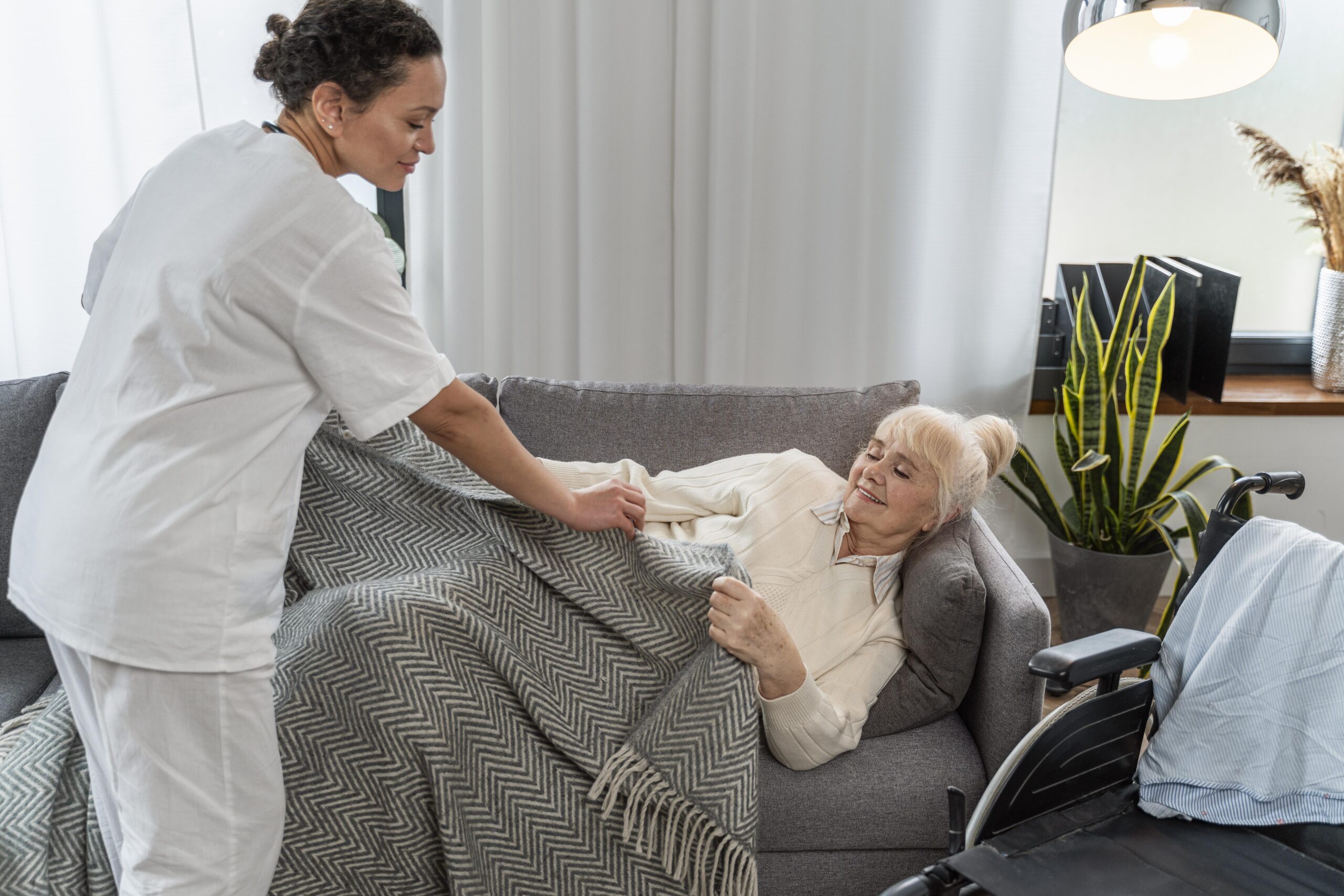 doctor-taking-care-senior-woman-home